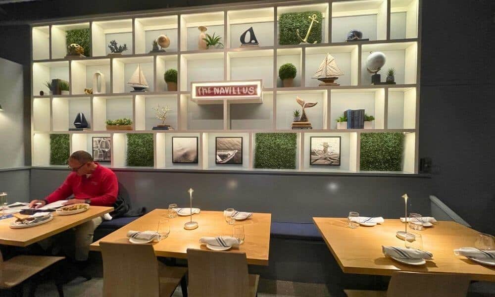 Dining room interior at a restaurant near Chatham, Massachusetts, with guests seated at Navillus Bar & Grill in Orleans.