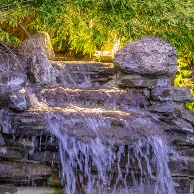 evening waterfall into the pool at Pleasant Bay Village Resort in Chatham, Ma.